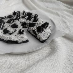 a piece of cake with oreo cookies and cream on it