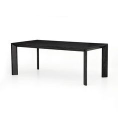 a black table sitting on top of a white floor