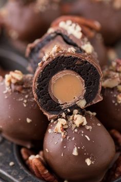 chocolate covered candies with nuts on top