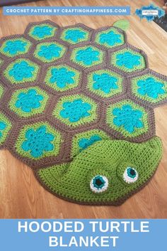 a crocheted turtle rug is on the floor