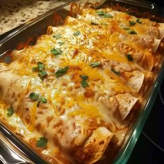 a casserole dish with cheese and chicken in it