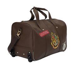 Embark on your next journey in enchanting style with this officially licensed Harry Potter Rolling PU Duffle Bag. Designed with a touch of magic, this duffle bag features patches, applique, and accents inspired by the Wizarding World, making it a must-have for any Harry Potter enthusiast. Inside the spacious main compartment, you'll find ample room to organize and carry your belongings, whether you're heading on a weekend getaway, a business trip, or an adventure to a wizarding destination. Than Themed Travel Bag With Case Included, Harry Potter Magic, Travel Channel, Travel Games, Duffle Bags, Travel Duffel, Business Trip, Luggage Accessories, Weekend Getaway