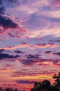 the sky is pink and purple with clouds