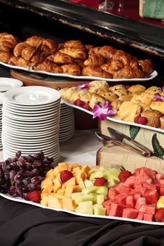 various pastries and fruit displayed on plates