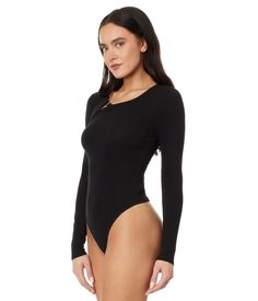 Flaunt the fit wearing the Skin™ Nan Asymmetric Henley Thong Bodysuit. This thong style bodysuit features crew neckline with button down detail on shoulder, and long sleeves..48% Pima cotton, 48% Modal, 4% spandex..Machine wash, tumble dry..Made in Peru..If you're not fully satisfied with your purchase, you are welcome to return any unworn, unwashed items in the original packaging with tags and if applicable, the protective adhesive strip intact. Note: Briefs, swimsuits and bikini bottoms should be tried on over underwear, without removing the protective adhesive strip. Returns that fail to adhere to these guidelines may be rejected. Asymmetrical Stretch Solid Bodysuit, Asymmetrical Stretch Solid Color Bodysuit, Fitted Asymmetrical Bodysuit In Solid Color, Fitted Asymmetrical Solid Color Bodysuit, Style Bodysuit, Women Skin, Top Collection, Workout Wear, Pima Cotton