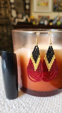 Set of seed bead earrings. Hand made. Made with glass seed beads, nylon thread, and gold plated hooks. Festive Gold Beaded Earrings, Glass Seed Beads, Seed Bead Earrings, Bead Earrings, Seed Bead, Dark Red, Beaded Earrings, Seed Beads, Jewelry Earrings Dangle