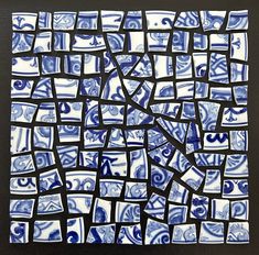 a blue and white mosaic tile with black lines on the bottom, which has been cut into squares