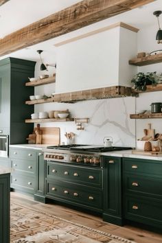 a kitchen with green cabinets and white counter tops, wooden shelves above the stovetop