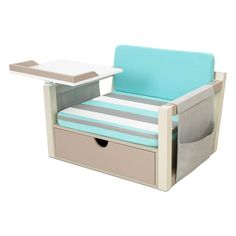 a small chair with a tray on top of it next to a table and drawers