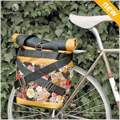 a bicycle with a flowered bag on the back