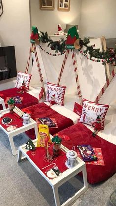 a group of red couches covered in christmas decorations