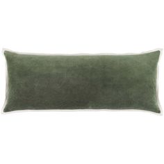 a green velvet pillow with white piping on the front and back, sitting against a white background