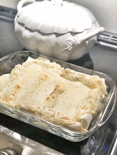 a casserole dish sitting on top of a stove