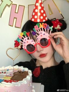 a woman wearing sunglasses and a birthday hat