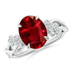 a ring with an oval red stone surrounded by diamonds