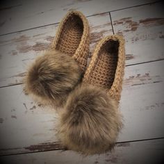 A beautiful pair of women's crochet slippers. Made of wool yarn they are so soft, warm, cozy to wear and have a lot of bulk for extra comfort. These slippers have eye-catching accent - fur pom pom. You can easily take off the pom pom, if you need to wash slippers. Soles are covered with latex, which makes them not slippery to walk and give it a longer life. Pom poms colors - white, beige, gray, black. You can select slippers color in option field. Don't forget to write pom poms color in note fie Hand Knitted Round Toe Slippers For Winter, Hand Knitted Round Toe Winter Slippers, Hand-knitted Round Toe Winter Slippers, Cozy Crochet Slippers For Winter, Crochet Round Toe Slippers For Winter, Winter Crochet Slippers With Round Toe, Cozy Yarn Slippers With Round Toe, Slippers Fur, Crochet Slipper Boots