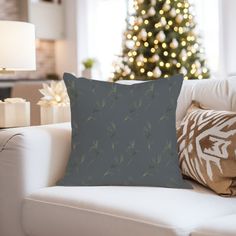 a living room filled with furniture and a christmas tree in the backgroung