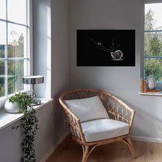 a chair sitting next to a window in a room