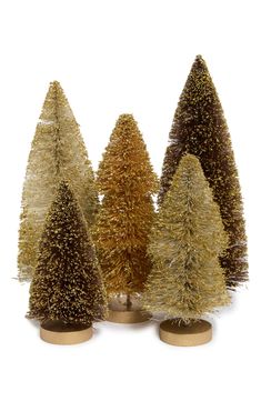 three different types of christmas trees in gold and brown