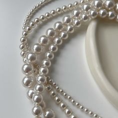 Introducing our exquisite Bridesmaid Necklace adorned with Swarovski pearls! This stunning accessory is expertly crafted to add a touch of elegance to any bridesmaid ensemble. The lustrous beauty of Swarovski pearls is complemented by delicate silver accents, creating a timeless piece that is sure to turn heads. Whether you're looking to express gratitude or enhance the overall wedding theme, our Bridesmaid Necklace is the perfect gift for your beloved bridesmaids. Make a statement with this elegant accessory and create memories that will be cherished for a lifetime. Indulging in the versatility of our Swarovski pearl necklaces, offering four distinct sizes (4mm, 6mm, 8mm, 10mm). These lustrous pearls, suitable for any occasion, elevate your style with elegance and grace, no matter the loc Classic Pearl Necklace For Bridesmaid Gift, Pearl Chain Necklace For Bridesmaid Gift, Pearl White Pearl Chain Necklace For Bridesmaids, Elegant Pearl Necklace For Bridesmaid Gift, Elegant Pearl Necklace For Bridesmaids, Pearl White Pearl Necklaces For Mother Of The Bride, Pearl White Pearl Necklace For Mother Of The Bride, Classic White Pearl Necklace For Bridesmaid Gift, Bridesmaid Gift Pearl Drop Bridal Necklace