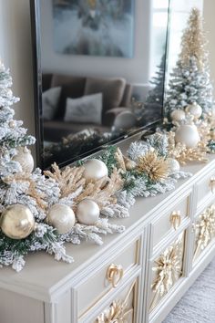 a decorated mantle with christmas trees and ornaments