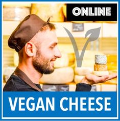 a man holding a piece of bread in front of a sign that says vegan cheese