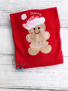 a small red bag with a ginger bear on it's side and the name giana