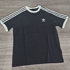 Nwt Adidas Kids 3 Stripes Short Sleeve Tee Medium - 11-12y Large - 13-14y Xlarge - 15-16y Casual Black T-shirt With Three Stripes, Classic Adidas Cotton Tops, Black Cotton T-shirt With Three Stripes, Black Cotton Tops With Three Stripes, Black Cotton Top With Three Stripes, Classic Adidas Short Sleeve Tops, Black T-shirt With Three Stripes, Adidas 3 Stripes Tee, Adidas 3 Stripes