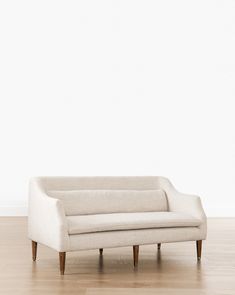 Formal meets modern with the streamlined shape of our Daxton Settee. Crafted with oak legs fitted with brass caps, and a large removable lumbar pillow, this piece instantly elevates any room it’s placed in. Styled in a large entry or a more formal sitting room, this cozy settee adds the perfect extra layer to your space. | McGee & Co. | Daxton Settee Formal Sitting Room, Mcgee & Co, Settee, Pop Up Shops, Custom Upholstery, Sitting Room, Lumbar Pillow, Upholstery, Cushions