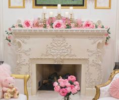 there is a fireplace with pink flowers on it and two teddy bears next to it