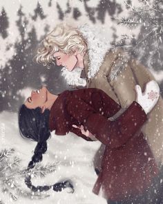 two people are kissing in the snow