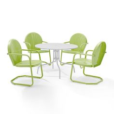 four green chairs around a white table