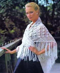 a woman wearing a white shawl and black dress