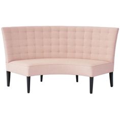 a pink couch sitting on top of a white floor