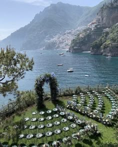 an aerial view of a lawn with tables and chairs set up in the shape of a heart