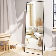 a large mirror in the corner of a room