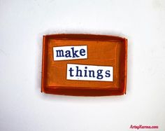 two magnets with words that say make things