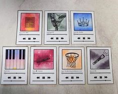 six cards with different designs on them sitting next to each other in front of a keyboard