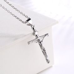 This necklace is a beautiful reminder of your faith. Made with 14K gold and sterling silver, this crucifix cross pendant necklace features Jesus on the front. You can wear this to any special occasion or just on your daily life. This will make you stand out in the crowd. The necklace has a crucifix medal charm with a beautiful chain design, which is very eye-catching and many people will notice you wearing this necklace when they see you on the road or in public places. The 14K gold-plated sterl Cross Accessories, Public Places, Holy Cross, Make A Gift, Sterling Silver Cross, Cross Pendant Necklace, Silver Cross, Christian Gifts, Gold Plated Sterling Silver