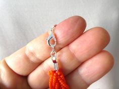 "This stunning necklace is made with orange braided seed beads. It has 12 strands and comes in all sizes at checkout. Size shown in pictures is 16\". Please read specifications on SIZES below: ❤ SIZES This item comes in several sizes, kindly choose at checkout. The easiest way to find out which length suits you best is to measure a necklace you already own, from one end to the next, including clasp. You can also use the diagram on the pictures as a reference, but keep in mind that we all have di Cheap Orange Hand-strung Beaded Necklace, Cheap Hand-strung Orange Beaded Necklace, Cheap Orange Necklaces With Tiny Beads, Cheap Orange Necklaces With Letter Beads, Cheap Orange Letter Beads Necklace, Affordable Orange Letter Beads Necklace, Summer Wedding Jewelry, Orange Beaded Necklace, Layered Beaded Necklaces