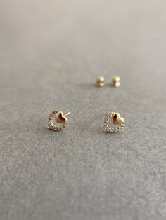 SCREW BACK/14K Solid Gold Tiny CZ Heart Stud Earrings- 14K Solid Gold Quantity: One Pair Color : Yellow Gold Materials : 14K Solid Gold Size : 6mm *14K Solid Gold will not tarnish. *Good for sensitive skin. * Metal components are 14K Solid Gold including earring backs. * Suitable for delicate and sensitive ears. * Comes in a jewelry box. If you need extra boxes for gifting....just let us know! Gold Heart Earrings With Diamond Accents For Gift, Gold Heart Cut Heart Earrings For Everyday, Gold Cubic Zirconia Heart Earrings In Dainty Style, Gold Heart Shaped Earrings With Diamond Accents, Gold Double Heart Earrings With Diamond Accents, Gold Dainty Heart Earrings With Cubic Zirconia, Dainty Gold Heart Earrings With Cubic Zirconia, Gold Heart Earrings With Diamond Accents, Tiny Dainty Yellow Gold Heart Earrings