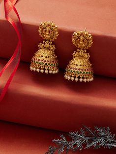 These exquisite Jhumka earrings feature a high gold finish, intricately designed with traditional gold elements that exude timeless elegance. The classic dome-shaped Jhumkas are crafted to perfection, showcasing the rich cultural heritage and craftsmanship in every detail. Perfect for weddings, festivals, or special occasions, making them a must-have accessory for those who appreciate the beauty of tradition. Temple Jewelry Jhumkas With Intricate Design For Diwali, Ceremonial Chandbali Jhumkas With Intricate Design, Traditional Jhumkas With Intricate Design For Festivals, Bollywood Style Ceremonial Jhumkas With Intricate Design, Bollywood Style Jhumkas With Intricate Design For Ceremonial Occasions, Traditional Intricate Design Jhumkas For Festivals, Traditional Intricate Jhumkas For Festivals, Temple Jewelry Jhumkas With Latkans For Celebrations, Ceremonial Jhumkas With Intricate Design For Diwali