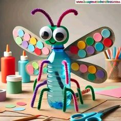 a craft project made out of plastic bottles and paper circles with a bug on it