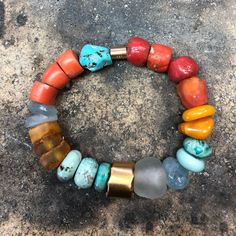 ANCIENT STONES WITH 22K GOLD CLOSURE • DESIGNED AND HAND FORGED IN NEW YORK • STONES: CORAL, TURQUOISE, AND AMBER BEADS • LENGTH: 6.5 INCHES Please email info@elihalili.com or call the studio at 212-941-7979 for any inquiries. Artisan Gold Beaded Bracelets With Natural Stones, Multicolor Fusion Bracelet With Natural Stones, Fusion Style Multicolor Natural Stone Bracelets, Gold Bohemian Beaded Bracelets With Stones, Fusion Style Multicolor Natural Stones Bracelet, Bohemian Gold Beaded Bracelets With Stones, Unique Hand-strung Gold Beaded Bracelets, Adjustable Gold Beaded Bracelets With Stones, Gold Fusion Beaded Bangle Bracelet