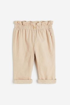 Jersey-lined pants in cotton corduroy. Paper bag waist with adjustable elasticized waistband  ruffle trim at top  and a decorative  faux wood button. Jumper Pants, Active Swimwear, Lined Pants, Short Playsuit, Kids Trend, Suit Shirts, Blazer And Shorts, Pink Kids, Fancy Dress Costumes