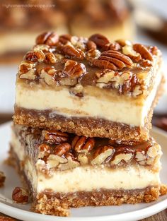 three pieces of pecan cheesecake stacked on top of each other