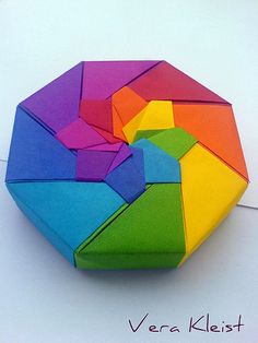 a multicolored geometric object is shown on the floor with words below it that read, vera kleist