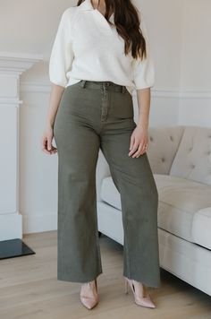 The Olive Green Wide Leg Jeans are an essential addition to any wardrobe. These classic jeans feature a flattering high waist, wide leg fit, and cropped style that flatters your figure and ensures comfort and flexibility throughout the day. Perfect for all seasons, these jeans provide timeless elegance and style. olive green wide leg pants high waist comfort stretch raw hem 98% cotton 2% spandex machine wash cold model is wearing a small SIZING CHART FOR THE JEANS: Small: fits sizing 25-26 Mediu Chic Wide Leg Cotton Pants For Elevated Casual, Chic Cotton Wide Leg Pants For Smart Casual Occasions, Chic Cotton Wide Leg Pants For Elevated Casual Wear, Non-stretch Wide-leg Jeans For Fall, Casual Wide Leg Cropped Jeans For Fall, Versatile High Waist Wide Leg Pants For Fall, Fall High-waisted Jeans For Everyday Wear, Solid Cotton Flare Jeans For Fall, High Rise Cotton Wide Leg Pants For Elevated Casual