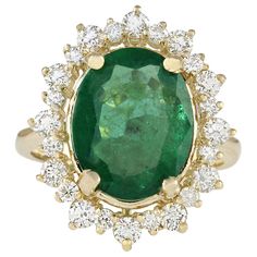 Introducing our exquisite 14 Karat Yellow Gold Diamond Ring, boasting a captivating 6.77 Carat Emerald at its center, stamped for authenticity. Crafted with precision and elegance, this ring is a symbol of luxury and sophistication. Weighing 7.2 grams, it features a stunning Emerald weighing 5.72 Carats, measuring 13.00x11.00 mm, radiating with vibrant green hues. Adorning the sides are sparkling Diamonds totaling 1.05 Carats, with F-G color and VS2-SI1 clarity, adding to its brilliance. The fac Luxury Engagement Ring, Engagement Rings Round Gold, Vintage Engagement Rings Round, Yellow Gold Cocktail Ring, Luxury Engagement Rings, Vintage Wedding Jewelry, Yellow Gold Diamond Ring, Gold Luxury, Engagement Ring For Women