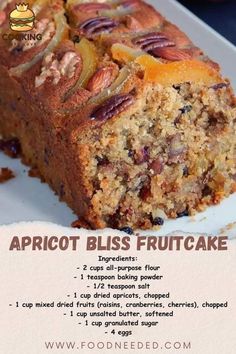 an advertisement for apricot bliss fruitcake on a white plate with oranges in the background